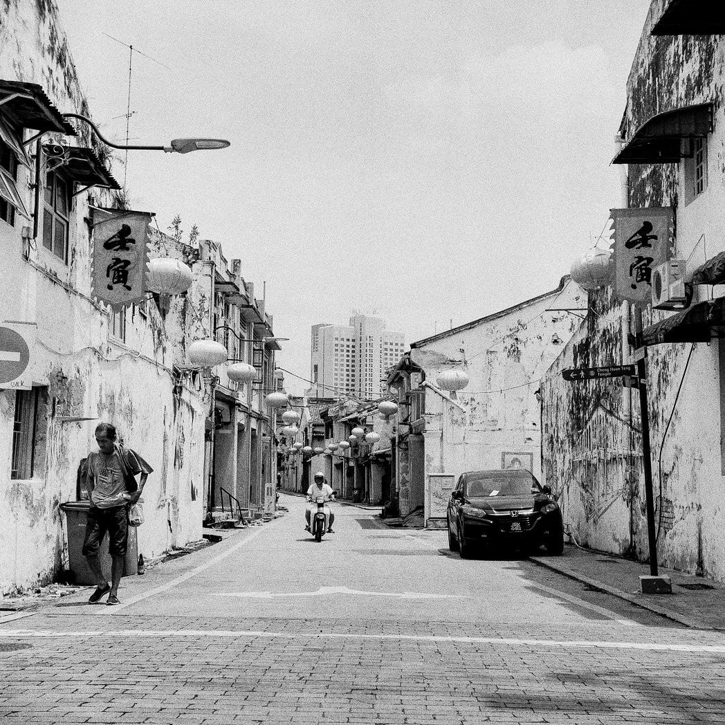 Street with moped - Foma Fomapan Active 400 ISO medium format black and white film example image