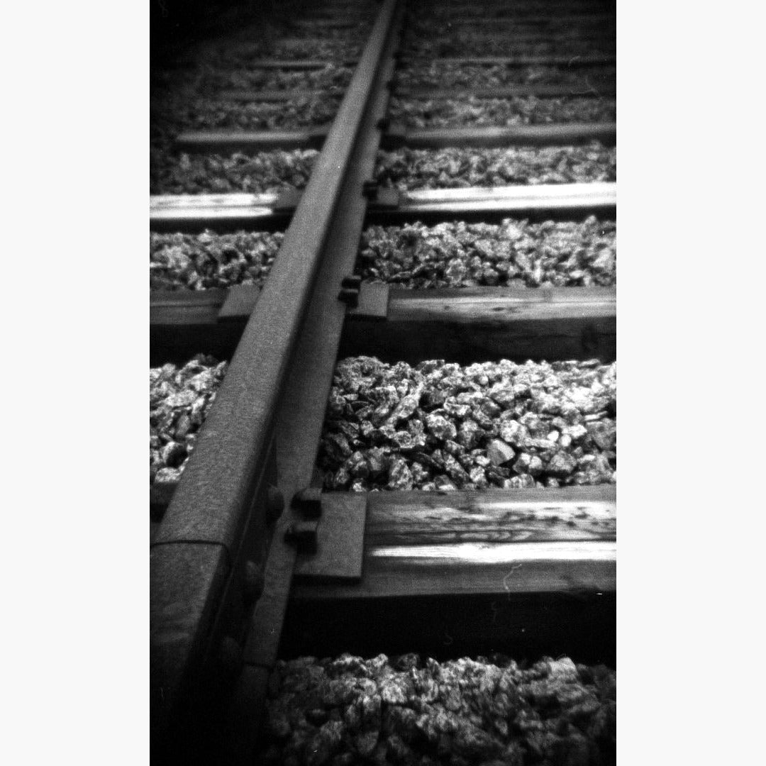 close up train tracks - Foma Fomapan Active 400 ISO 35mm black and white film example image
