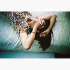 woman laying on bed photographed on Kodak UltraMax 400 ISO 35mm colour negative film – example image
