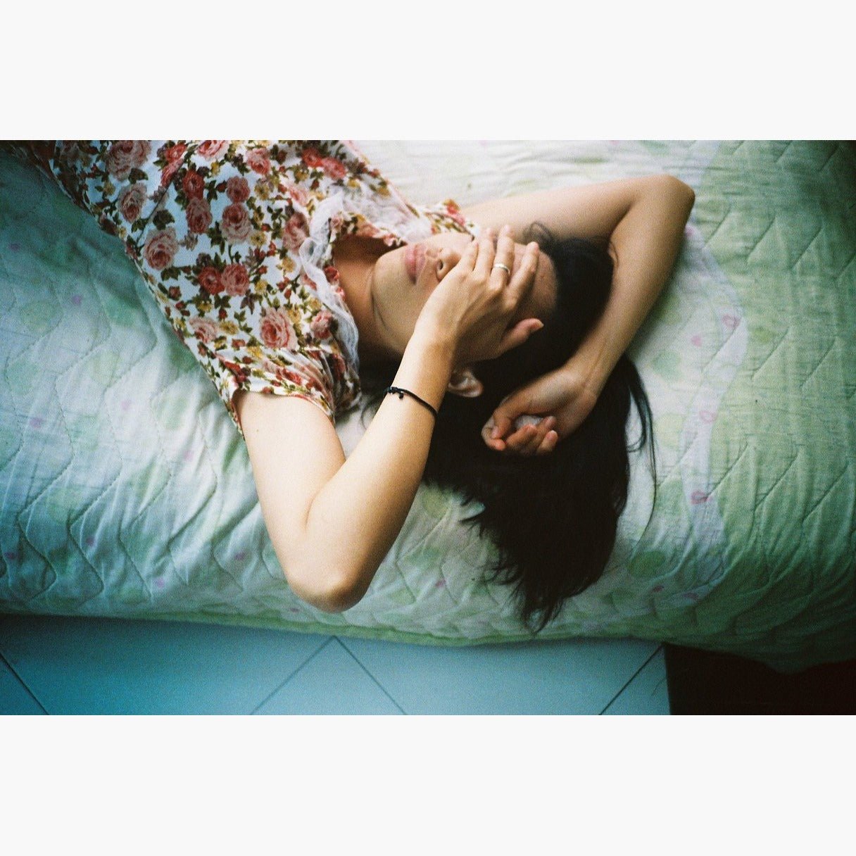 woman laying on bed photographed on Kodak UltraMax 400 ISO 35mm colour negative film – example image